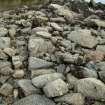 A segment of laid foundation stones among the tumbled remains of the low-water quay. (Paula Martin)