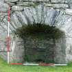 The draw-arch of the S kiln at Park. The arch of the partly buried stoke-hole is visible near ground level. Scale poles 2 metres. (Colin Martin)