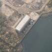 Oblique aerial view of the remains of Inverkip power station during post-demolition clearance, looking to the SSW.