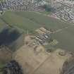 General oblique aerial view of Castlandhill Radio Station, pillboxes, farmsteading, cottage and reservoirs, looking NW.