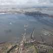 General oblique aerial view of the construction of the new Queensferry, the Forth Road Bridge and Port Edgar, looking N.