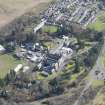 Oblique aerial view of Queen Victoria School, looking SE.