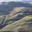 General oblique aerial view of Menstrie Glen with Dumyat beyond, looking W.