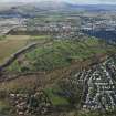 General oblique aerial view of Stirling Golf Course, the King's Park and the disused race course with Stirling Castle beyond, looking NE.