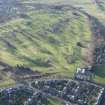 Oblique aerial view of Stirling Golf Course, the King's Park, the disused race course and the dam, looking SW.