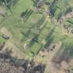 Oblique aerial view centred on part of the disused race course, the farmstead and the golf course, looking NNW.