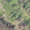 Oblique aerial view centred on part of the disused race course, the farmstead and the golf course, looking N.