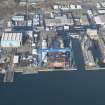 Oblique aerial view of HM Dockyard Rosyth centred on the Goliath Crane, looking NE.
