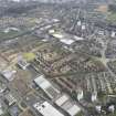 Oblique aerial view of Lochee, looking SE.