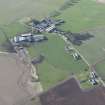 Oblique aerial view of the former site of Inch Military Airfield, looking W.