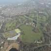 Oblique aerial view of Duddingston House and golf course and Holyrood Roman Catholic Secondary School, looking to the ENE.