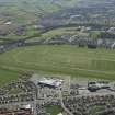 Oblique aerial view of Ayr Airfield and Ayr Racecourse, looking N.