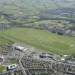 Oblique aerial view of Ayr Airfield and Ayr Racecourse, looking NW.