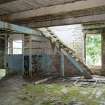 Interior. Ground floor level area adjacent to Dispatch and Office area. Possibly storage area for boxed margarine.  View of access to first floor.