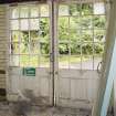 Interior. Ground floor. Post 1911. Former milk receiving area. Detail of loading door from south.