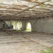 Interior. 1911 building from west looking towards former churn area which is the southern end of the main 3 storey and attic range. Note the concrete floor and drain.