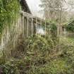 South elevation. View of glasshouse lean-to from South West. The potting shed is on the right.