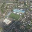 Oblique aerial view of Palmerston Park, home of Queen of the South FC, looking NE.
