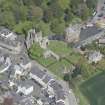 Oblique aerial view of Kelso Abbey and War Memorial, looking NNE.