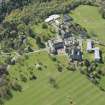 Oblique aerial view of Colinton Castle and Merchiston Castle School, looking W.