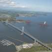 Oblique aerial view of the Forth Bridge, Forth Road Bridge and  construction of the Queensferry Crossing, looking NE.