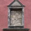 Detail of pedimented blank date panel on front elevation of 124 Canongate, Edinburgh.