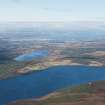 General oblique aerial view of Loch Duntelchaig, Inverness, the Kessock Bridge and Beauly Firth, looking NNE.