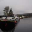 Fort Augustus Upper basin looking along south bank showing barge Scottish Highlander in foreground looking W