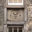 Detail of inscription between 2nd and 3rd floors at Shoemakers' Land, 195-197 Canongate, Edinburgh.