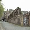 View of remnants of boundary wall of former Gas Works, Old Tolbooth Wynd, Edinburgh, from N.