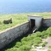 View over lighthouse enclosure and privy to chapel, facing SW.