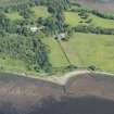 Oblique aerial view of the fish traps at Brecknish and Ardmore House, looking NNW.