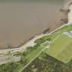 Oblique aerial view of the fish trap and the Fort George sports ground, looking SW.