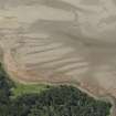 Oblique aerial view centred on the possible fish trap, looking SW.