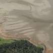 Oblique aerial view centred on the possible fish trap, looking SW.