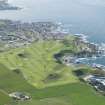 Oblique aerial view of the Royal Tarlair Golf Course with Macduff beyond, looking W.