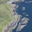 Oblique aerial view of Meall nan Gamhna, Staffa, centred on the jetty, looking NNE.