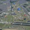 Oblique aerial view of T in the Park centred on the Main Stage with King Tuts Wah Wah Tent beyond, looking SE.