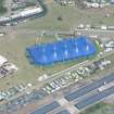 Oblique aerial view of T in the Park centred on King Tuts Wah Wah Tent, looking NNE.