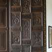 1st floor. Dining room. Detail of carved panelling in window recess.