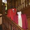 Staircase. Detail of former captains red jackets.