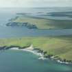 Oblique aerial view of The Garths, Unst, looking SSW.