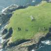 Oblique aerial view of The Garths, Lamba Ness, Unst, looking SE.