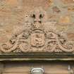 Detail of coat of arms above entrance on south front.