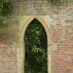 Walled garden. Arched entrance.
