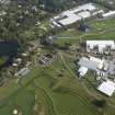Oblique aerial view of The PGA Golf Course Spectator Village and 1st Tee, looking NE.