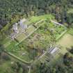Oblique aerial view of Drummond Castle and formal garden, looking N.