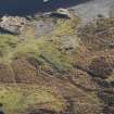 Oblique aerial view of military remains, looking SSE.