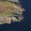 Oblique aerial view of military remains, looking NNE.