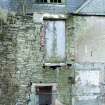 Exterior. Detail of windows and doorway on north elevation.